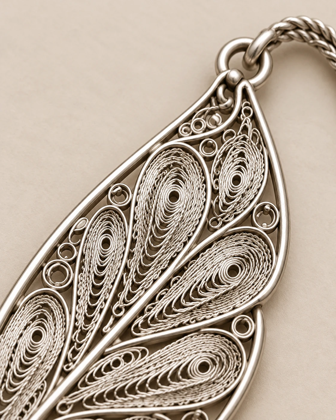 Concept detail of the openwork wires and tassel attachment of the filigree bookmark