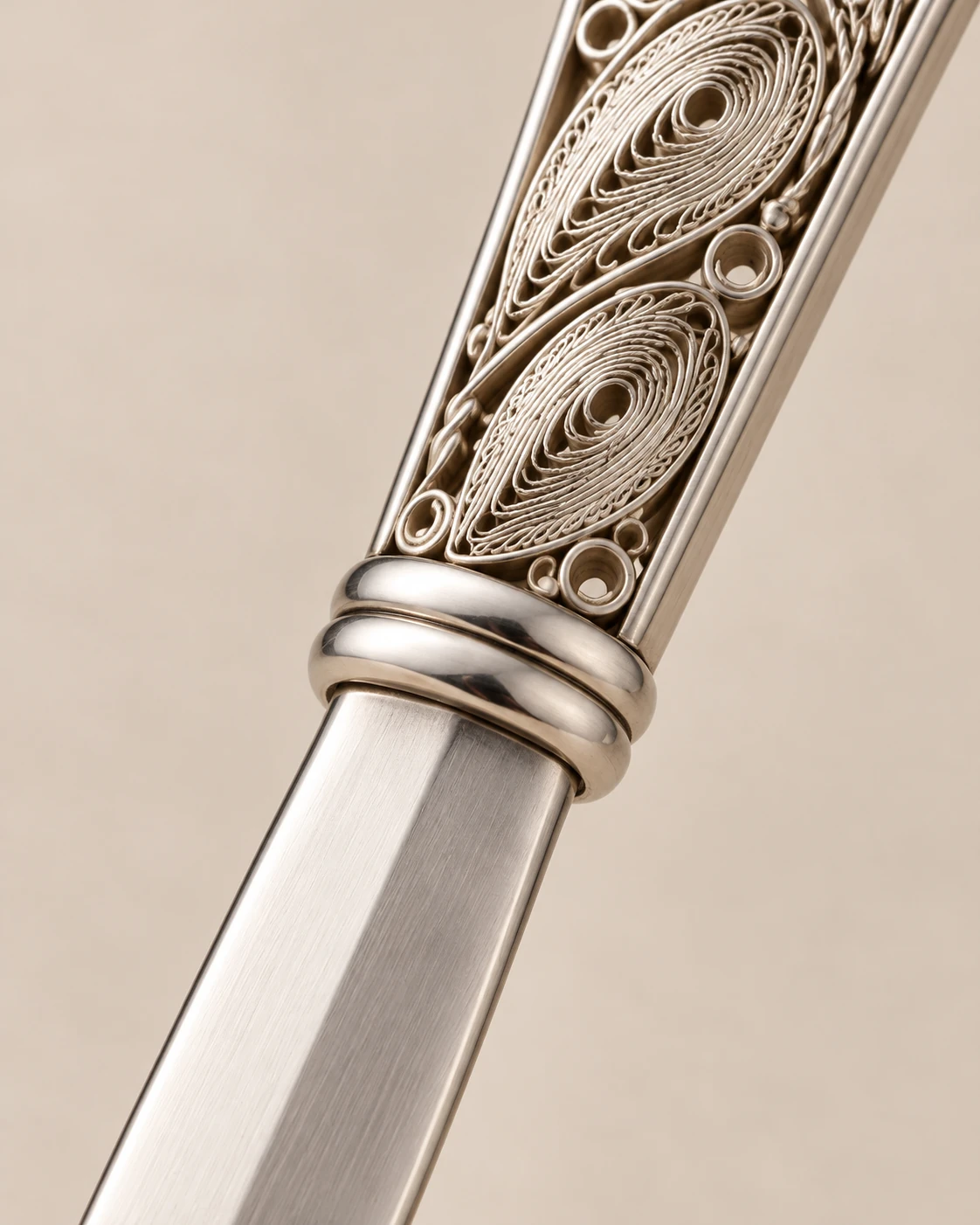 Concept detail of the joint between the blade and openwork handle of the filigree letter opener