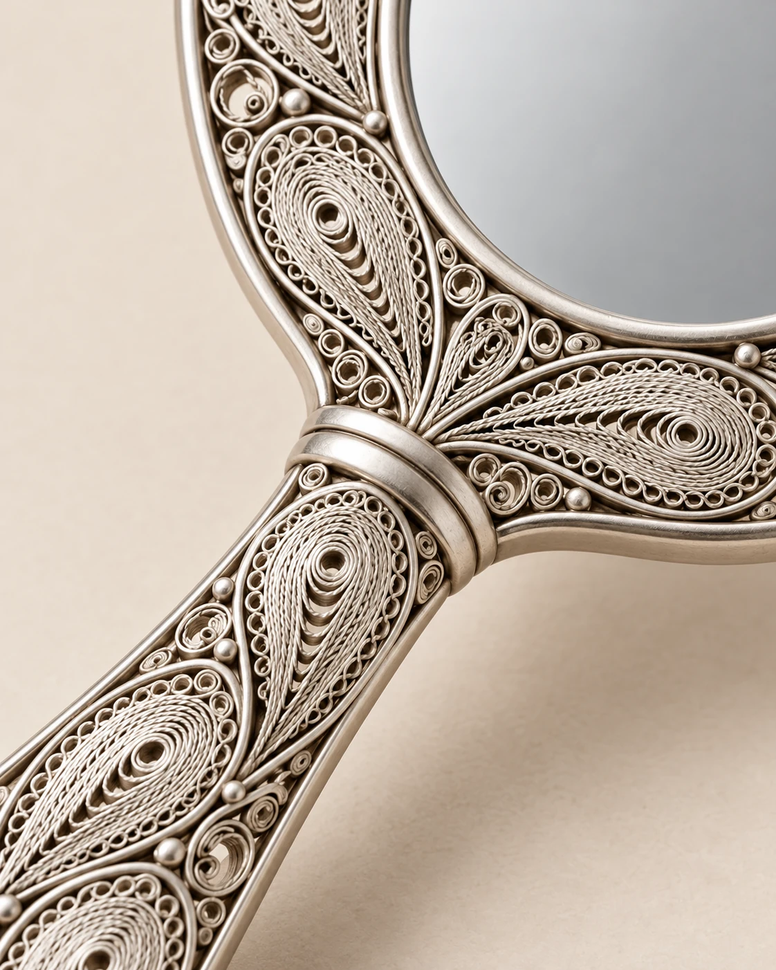 Concept detail of the handle, spirals and oval outline of the filigree hand mirror