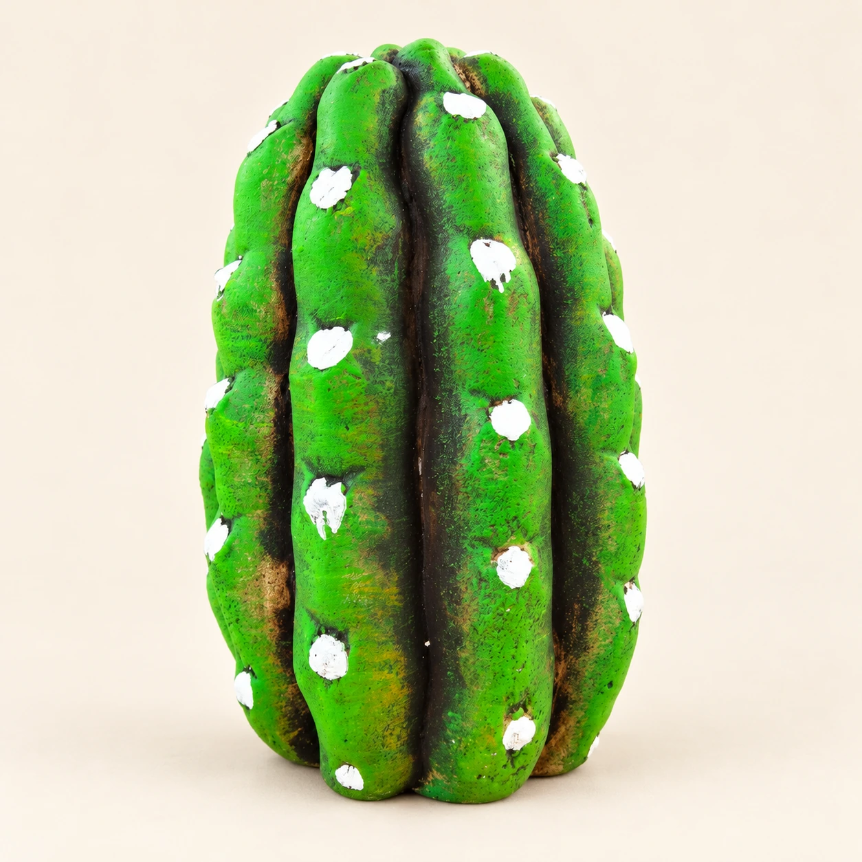 Green prickly pear pad with white flowers, a Nativity scene inside and an integrated base — rear view