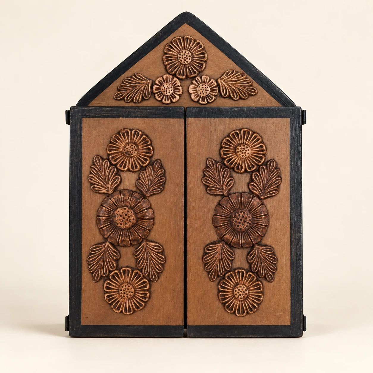 Open brown musicians retablo with a triangular crest, floral doors and polychrome figures — closed doors